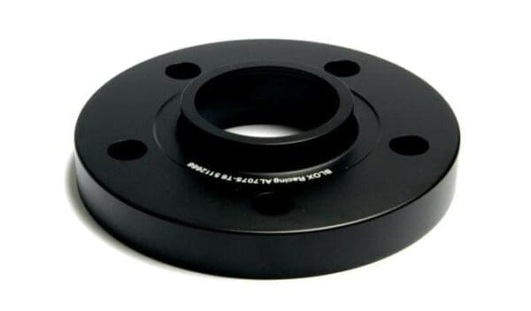 Black circular flange with central hole.