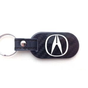 Keychain with logo on a black background.