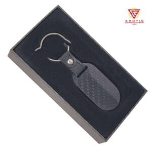 Black carbon fiber keychain in box.