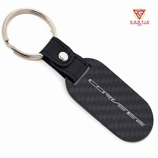 Black carbon fiber keychain with silver logo.