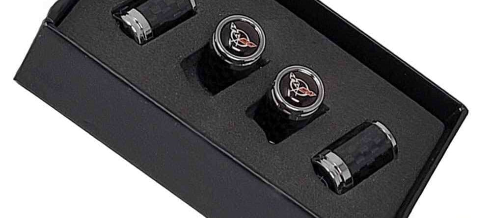 Carbon fiber valve stem caps in a box.