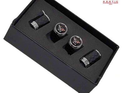 Carbon fiber valve stem caps in a box.