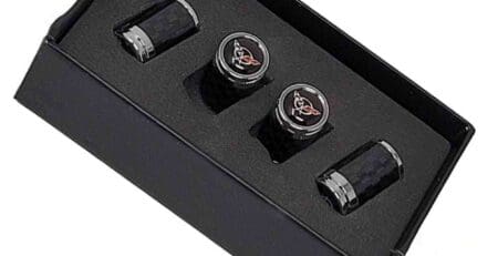 Carbon fiber valve stem caps in a box.