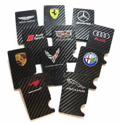 Car logos on carbon fiber backgrounds.