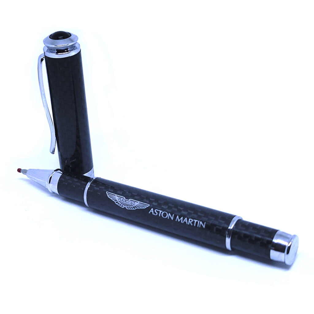 Black fountain pen with silver accents and cap removed.