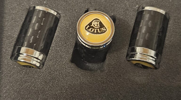 Lotus Tire Valve Caps Black Logo Yellow Background